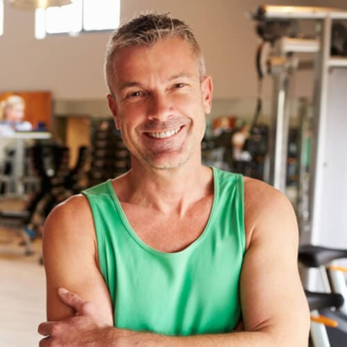 Portrait Of Mature Man Standing In Gym